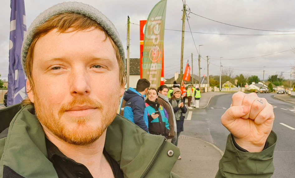 Denman Rooke with fist up on the Corrib Oil Picket in Ballinasloe.