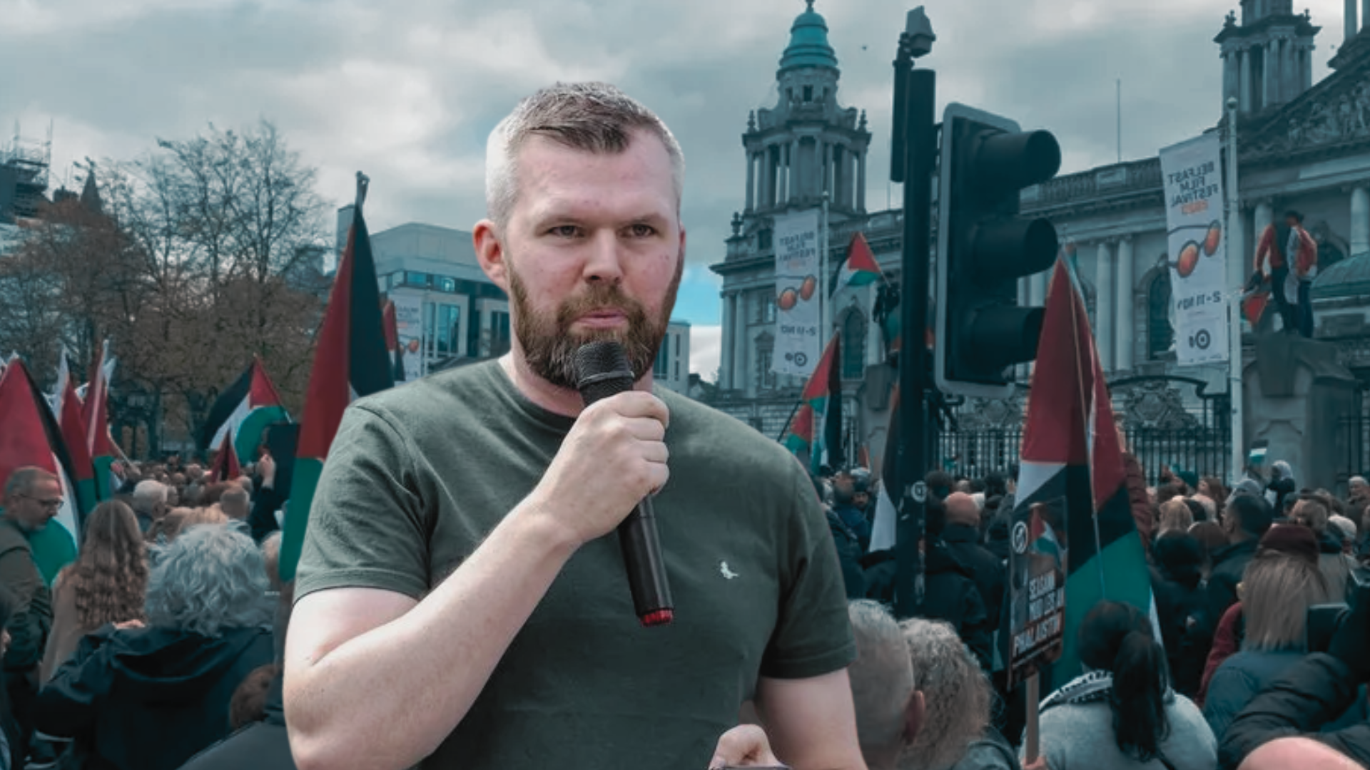 Composite Image of Gerry Carroll speaking on a microphone at a Belfast Palestine Solidarity Rally