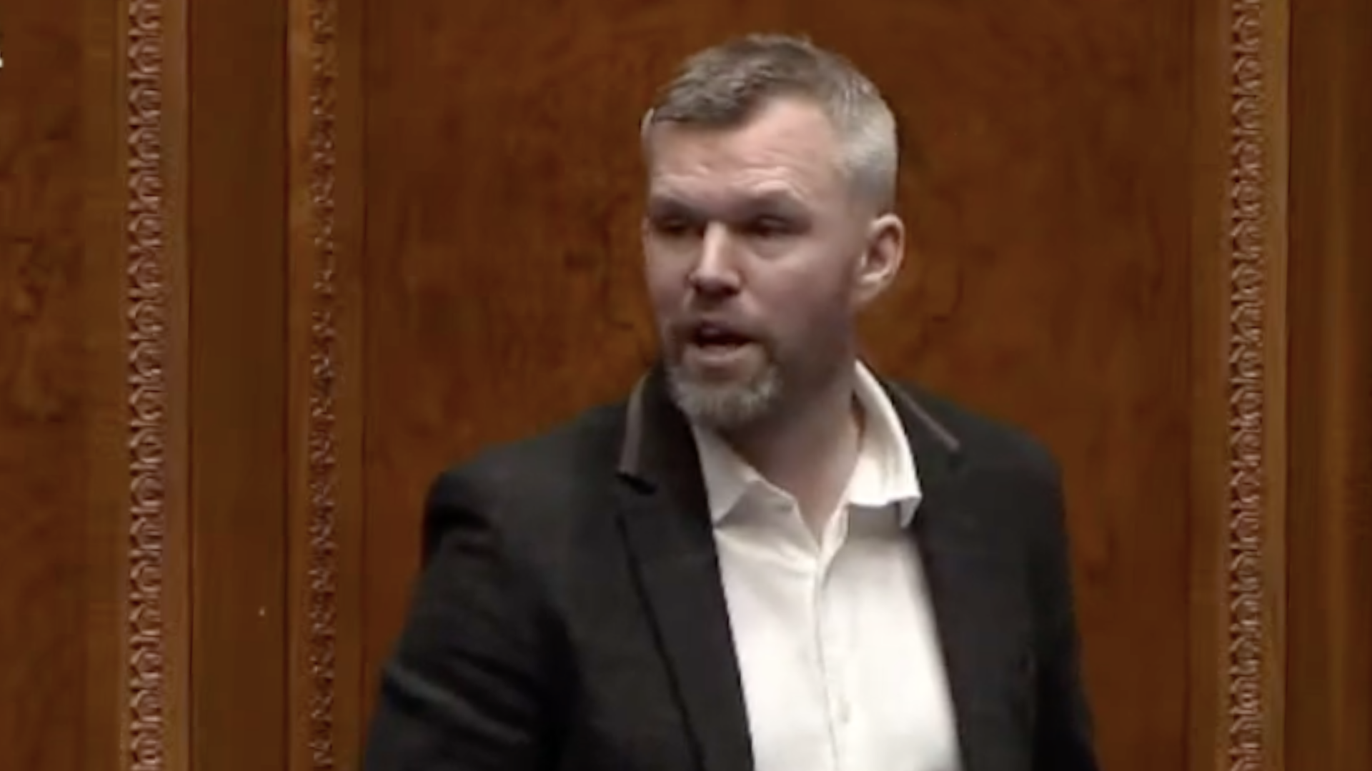 Screen Grab from Gerry Carroll's introduction to the Motion of No Confidence in Paul Givan as Minister for Education in Stormont 10 November 2025