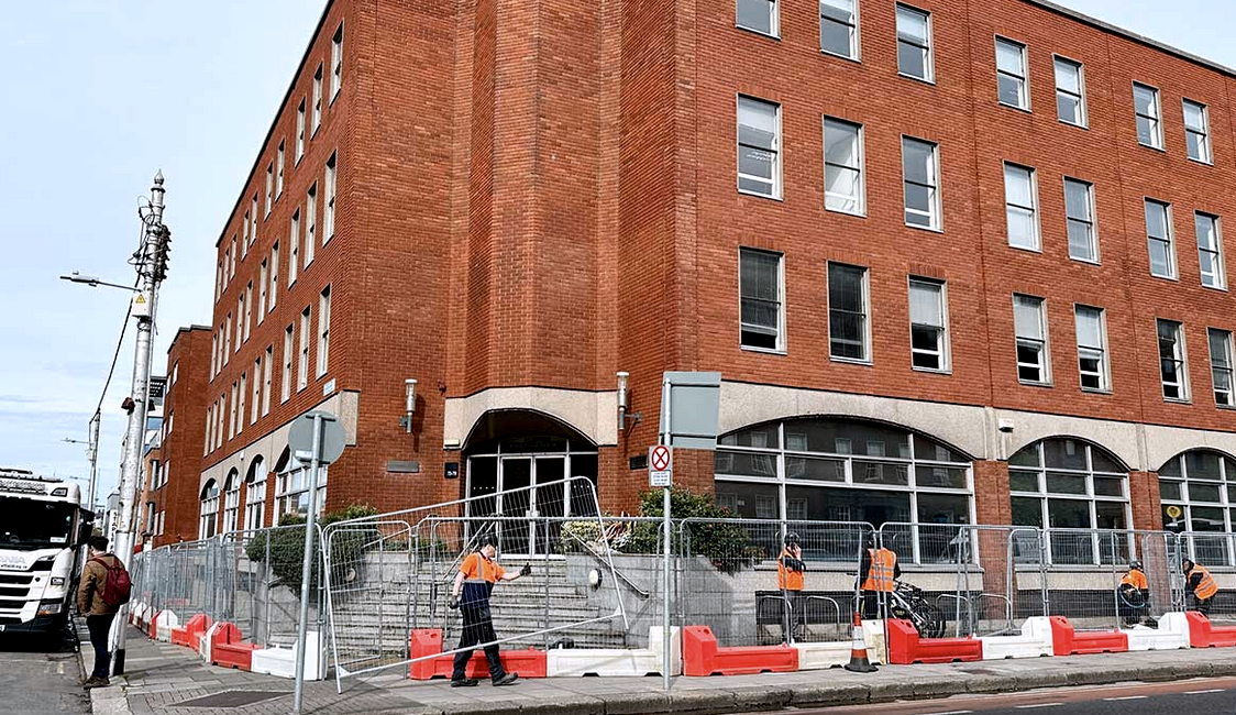 Workmen installing barricades around the International Protection office in Dublin.