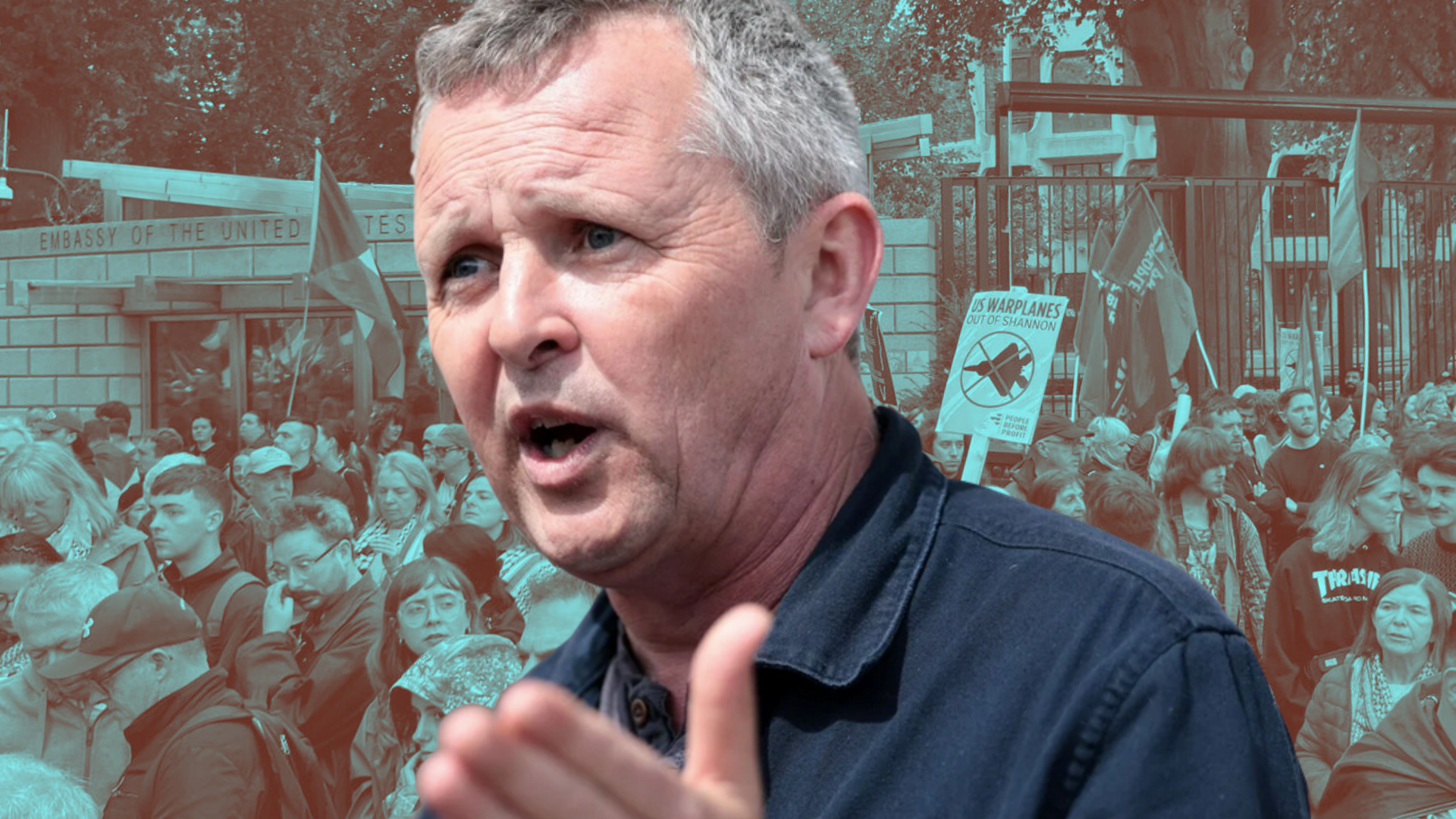 Richard Boyd Barrett pictured over a photo of an anti war protest at the gates of the Embassy of the United States in Dublin Ireland. Placard reads US Warplanes out of Shannon.