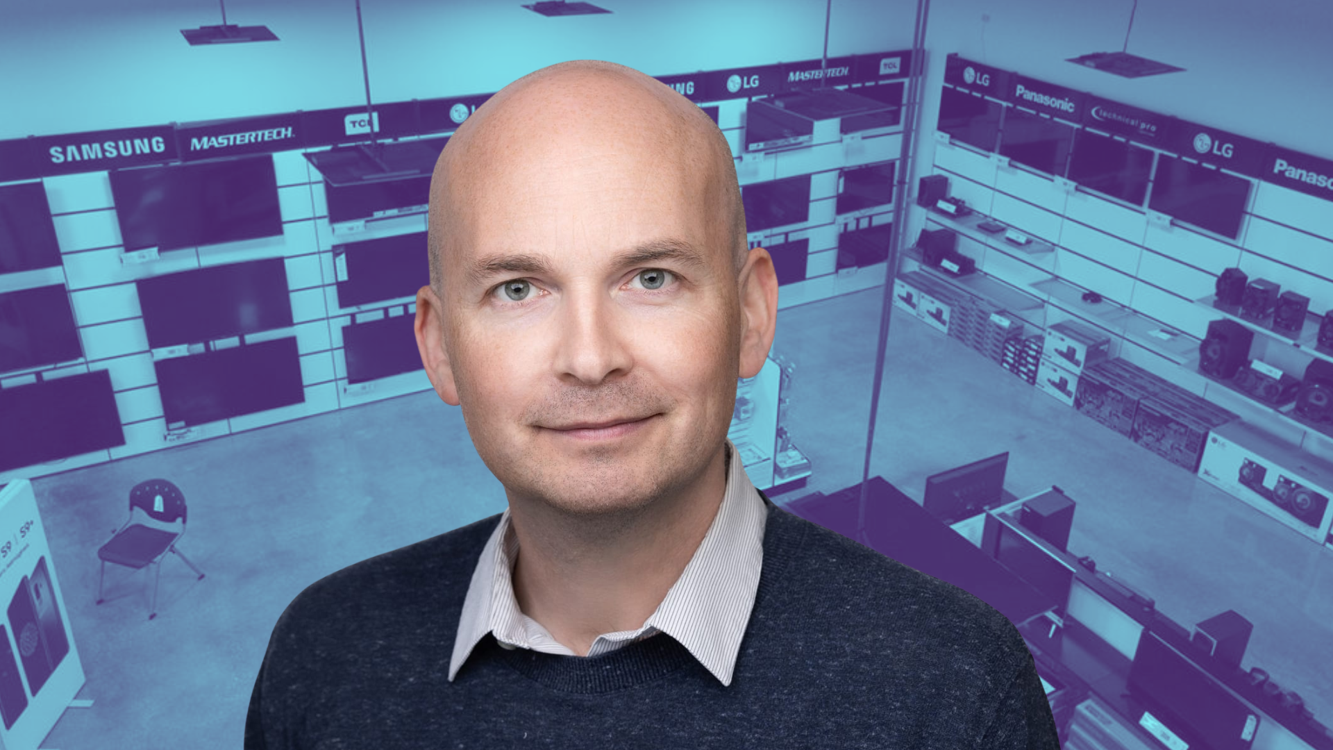 Paul Murphy in front of televisions