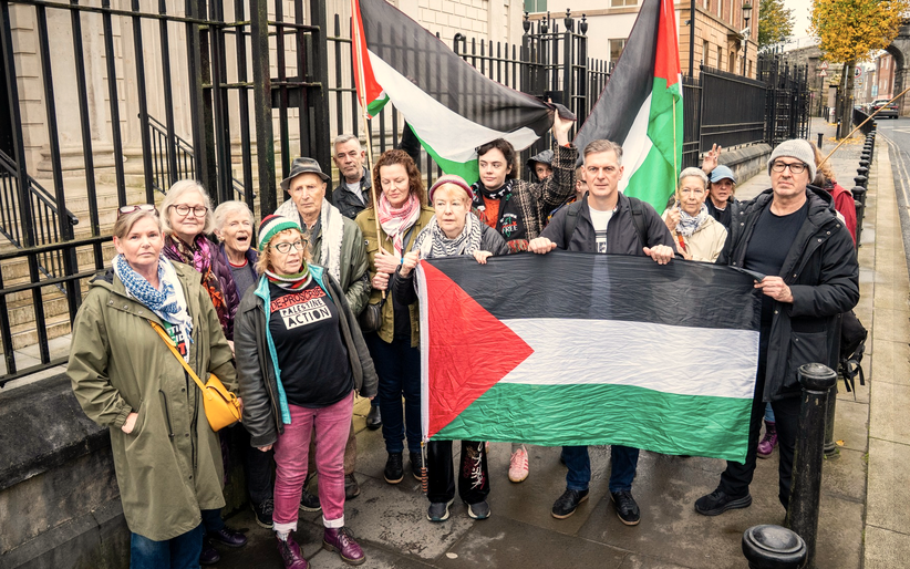 Supporters of the Palestine solidarity protesters holding Palestine flags