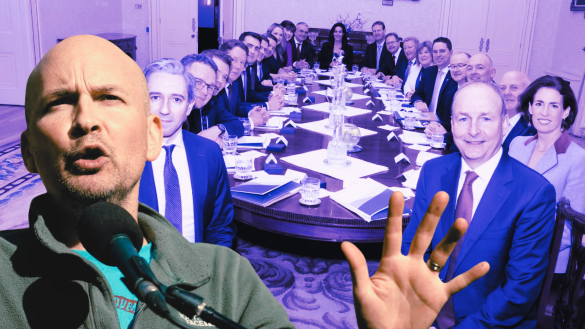 Paul Murphy of People Before Profit holding up his hand in front of an image of a 21-member cabinet table. Headed by Micheal Martin and Simon Harris.