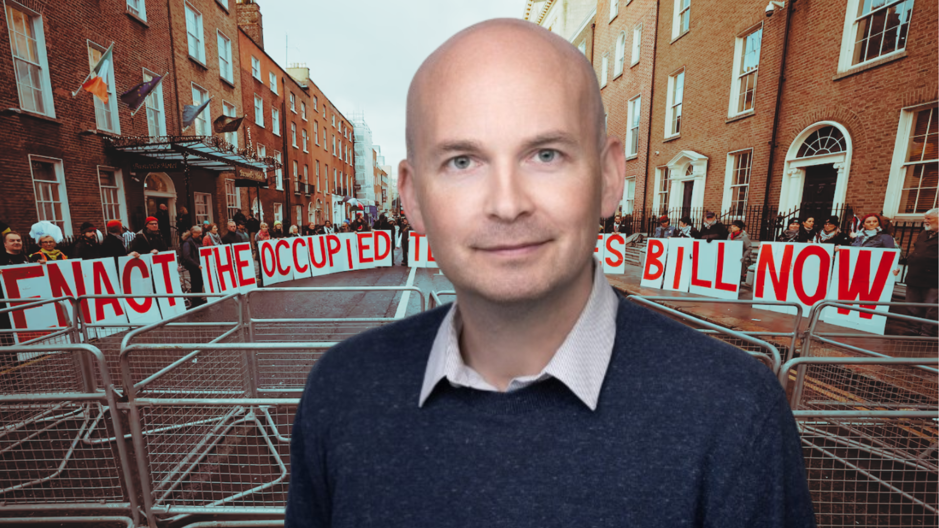 Paul Murphy in front of an image of protestors with giant single letter cards spelling out ENACT THE OCCUPIED TERRITORIES BILL NOW.