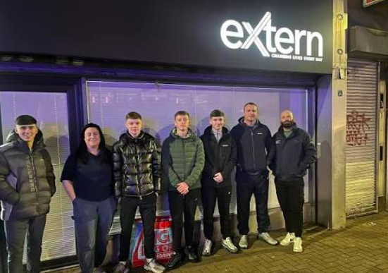 Extern Workers and Volunteers in front of their office