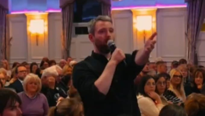 Marc Mac Seáin speaking at the Save Daisy Hill public meeting in Canal Court.