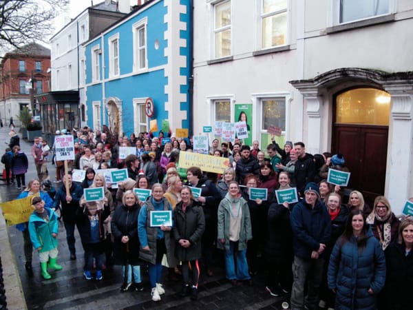 SNAs and school community members protest proposed cuts in Dundalk as Government 'pauses' cruel cut.