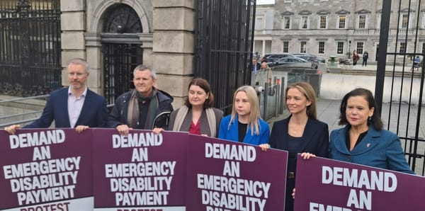 Party reps and leaders stand with Richard Boyd Barrett behind placards saying Demand An Emergency Disability Payment, advertising the protest this weekend. 