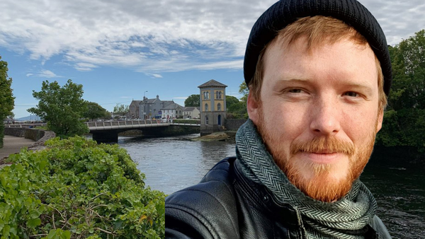 Denman Rook in front of a bridge. Denman Rooke condemns government failure to act on climate impacts.