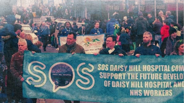 SOS Daisy Hill Hospital Campaign Banner in St Patrick's Day parade. Marc Mac Seáin holding the banner with other activists. 