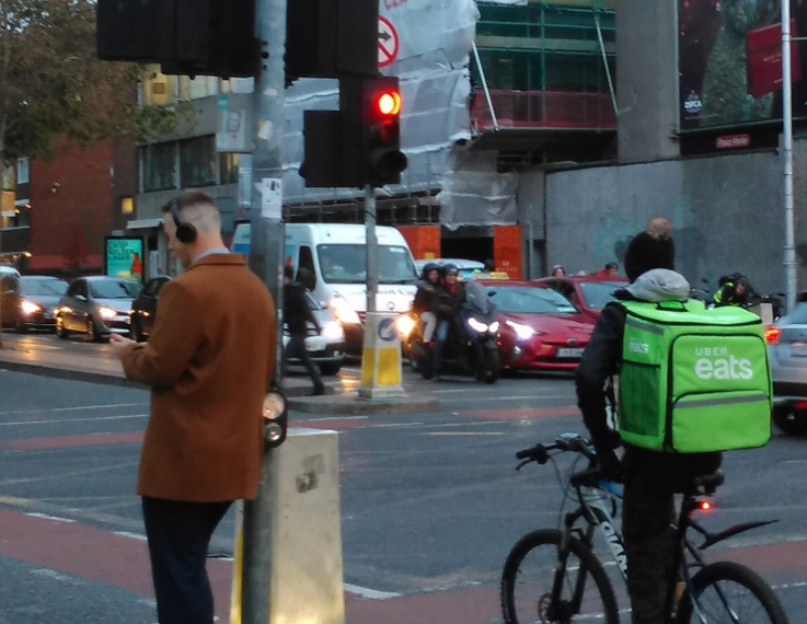 Delivery Rider waiting at traffic junction