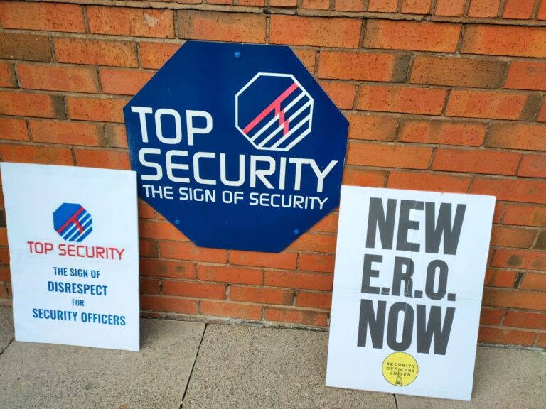TOP SECURITY DROP THE HIGH COURT CHALLENGE NOWprotest signs at the entrance of Westgate Business Park Ballymount